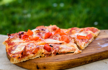 Making of homemade Italian pizza in fireplace brick oven.