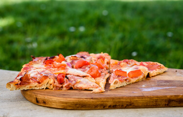 Making of homemade Italian pizza in fireplace brick oven.