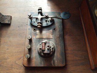 old Morse code or telegraph key with copper wire