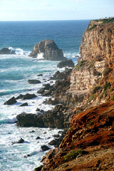 rocky cliff at typical beach at the west coast of Portugal
