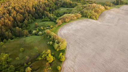 Naklejka premium aerial landscape at sunrise. natural summer background. drone shot