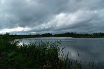 Cloudy sky in the morning over the lake