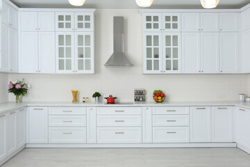 Fototapeta na wymiar Elegant interior of new kitchen with stylish furniture