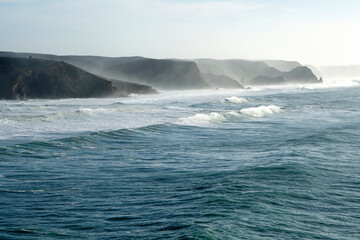 Fototapeta premium waves rolling against cliffs at Portugals Wild West coast