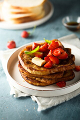 Strawberry French toast with maple syrup and butter