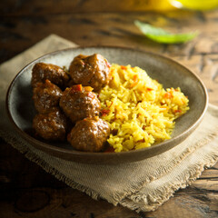 Homemade meatballs with spicy rice