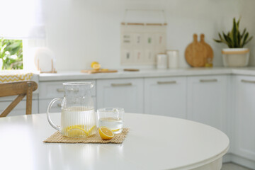 Lemonade on white table in modern kitchen. Interior design