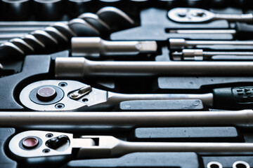 Set of car tools in toolbox. Repair service. Toolkit. Adjustable metallic tools in auto shop.