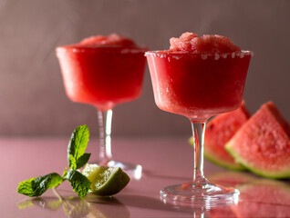Refreshing summer frozen watermelon margaritas with lime and mint. 