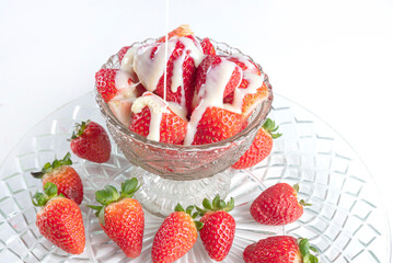 Arrangement with beautiArrangement with beautiful strawberries and condensed milk and accessories