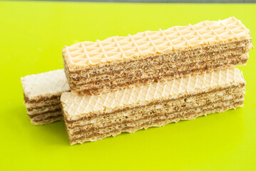 Wafers with chocolate filling on a green background