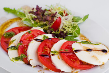 Caprese salad with pesto sauce. High quality photo