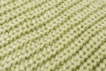 texture of woolen knitted fabric, diagonal arrangement, green color