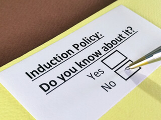 One person is answering question about induction policy.