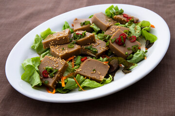 Seasoned Acorn Jelly Salad which is called Muk made of buckwheat