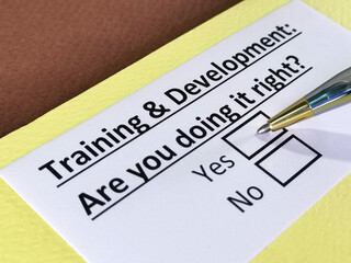 Obraz premium One person is answering question about training and development.
