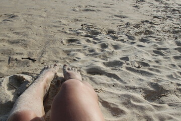 Beach with white sand blue water beautiful clean legs
