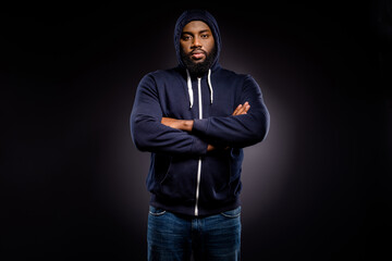 Photo of afro american guy anti racism activist cross hands wear sweater isolated over black color background