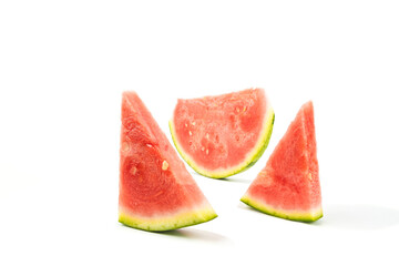 Seedless watermelon on a white background. three pieces of watermelon.