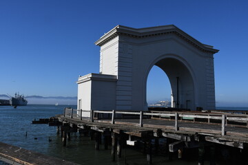 Promenade along Pier 43 Ferry Arch at Fisherman's Wharf - one of the well known tourist attractions in the western USA in San Francisco, California
