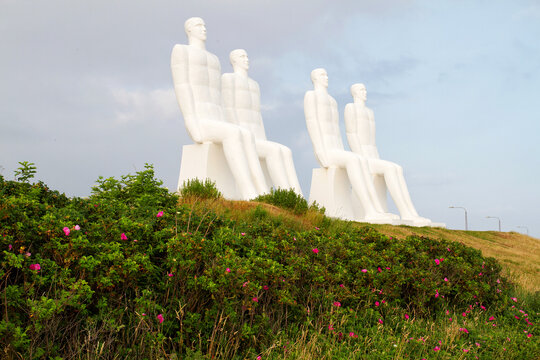 ESBJERG - JULY 9: The sculpture "Man meets the Sea". The white man is 9 m high and made in concrete by the Danish artist Svend Wiig Hansen. Esbjerg, Denmark on July 9, 2011.