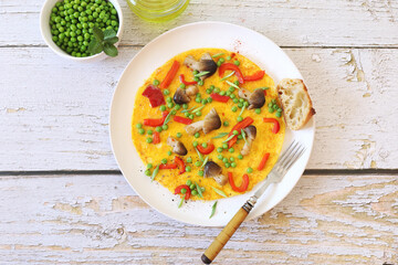 Omelet with green peas, red bell pepper and mushrooms for hearty breakfast