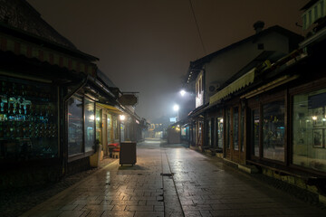 Fototapeta na wymiar Bascarsija in Sarajevo, Bosnia and Herzegovina. The famous shopping area at foggy night