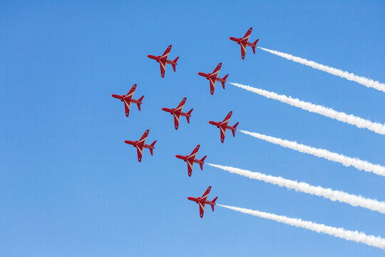 Swansea, UK: July 03, 2016: The Red Arrows display team fly in formation at Swansea Air Show. The annual free event attracts thousands of visitors.