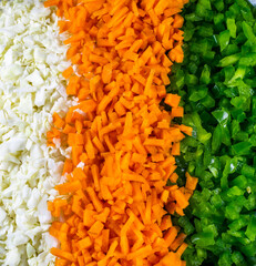 chopped cabbage, carrot and green capsicum nicely arranged in plate