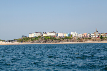 Fototapeta na wymiar Sailing the Pembrokeshire coast at Tenby to explore the coastline and see the wildlife including seals and puffins and visit Caldey Island.