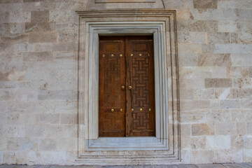 Fototapeta na wymiar Historical brown door from Suleymaniye Mosque, Istanbul