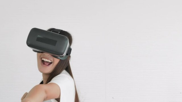 Asian teenage girls boxing in virtual reality in home. happy woman relax, lifestyle and Technology concept