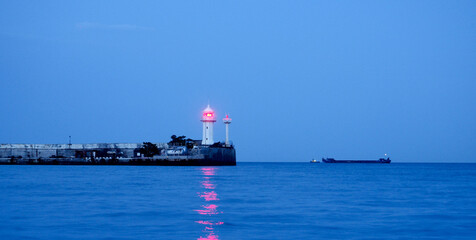 banner lighthouse at sunset in the twilight in clear weather in Crimea