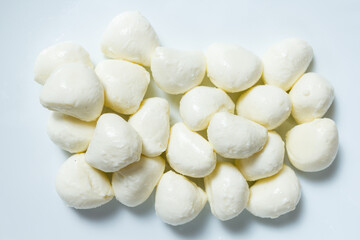 Mini mozzarella cheese balls on a white plate