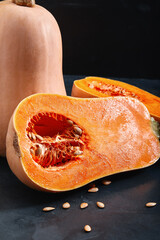 Muscat pumpkin dark background. Close-up photo for grocery catalog store.
