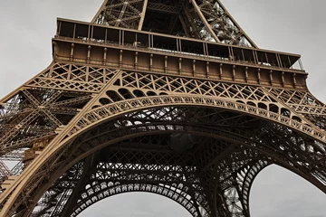 Fotobehang Mid structure view of the Eiffel Tower up close © Eadwine
