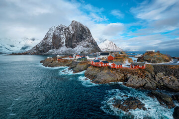 Hamnoy fishing village with red rorbu houses in Norwegian fjord in winter. Lofoten Islands, Norway