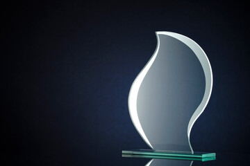 Stylish flame shaped glass trophy with copyspace