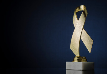 Symbolic textured gold ribbon trophy award