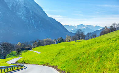 Road in the spring valley in Switzerland.