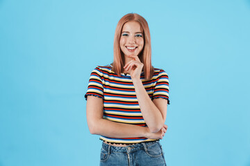 Image of joyful girl in striped t-shirt looking and smiling at camera
