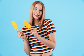 Image of cheerful pretty girl holding ice-cream and laughing