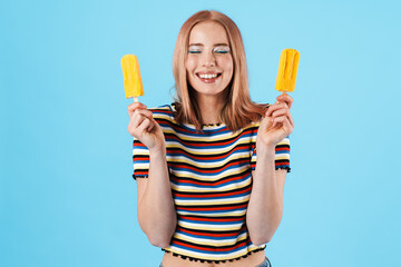 Image of cheerful pretty girl holding ice-cream and laughing