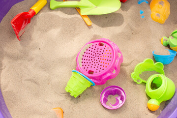 Fototapeta na wymiar children's sandbox with bright toys
