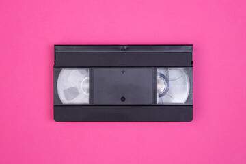 Obraz premium VHS tape from the 80s and 90s on pink background and space to write on it