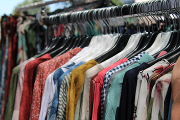 colorful cotton clothes on hangers