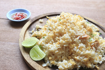 Fried rice on a wooden background.