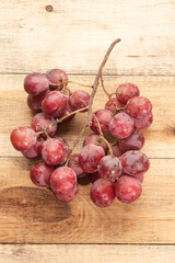 Tasty grapes on a wooden table. Healthy food