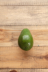 Juicy and tasty avocado on a wooden table. Healthy food