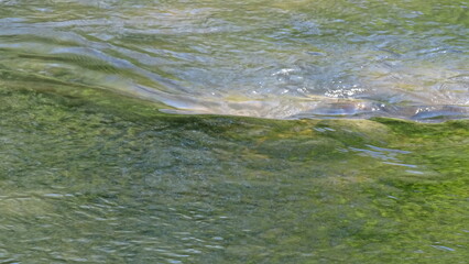 water flowing into the river